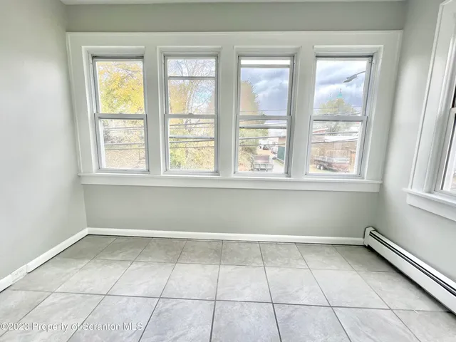 a view of a room that has a window in it