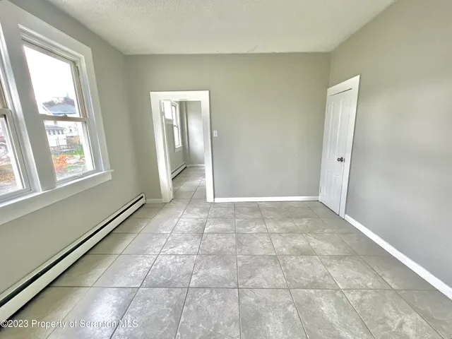 a view of an empty room and window