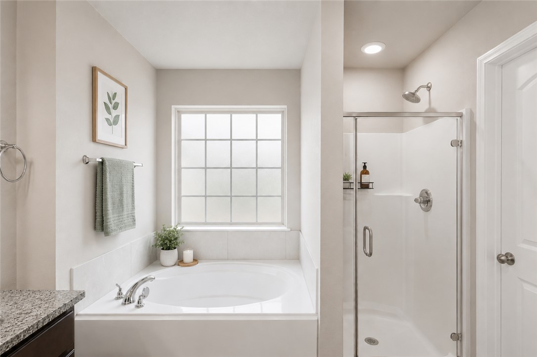 2725 Porter's Way Bryan, TX 77803 - Photo 13 of 19 a bathroom with a bathtub and a shower
