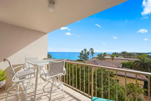 a view of a balcony with chairs