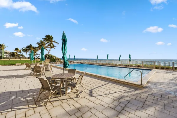 a view of a swimming pool and an outdoor space