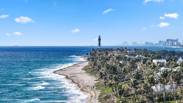 a view of an ocean beach and a building