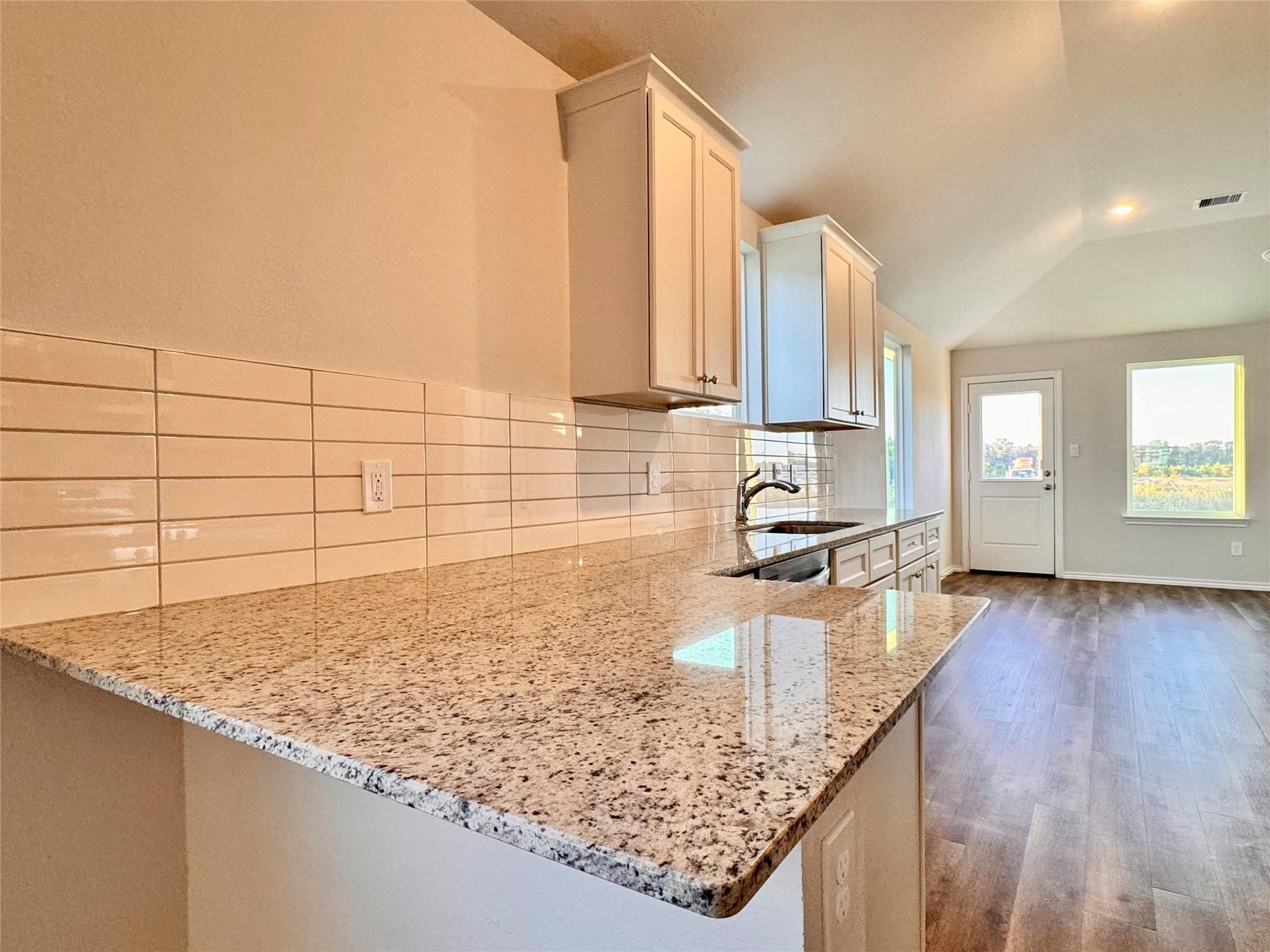 25786 John Wayne Court Splendora, TX 77372 - Photo 8 of 17 a kitchen with sink and cabinets