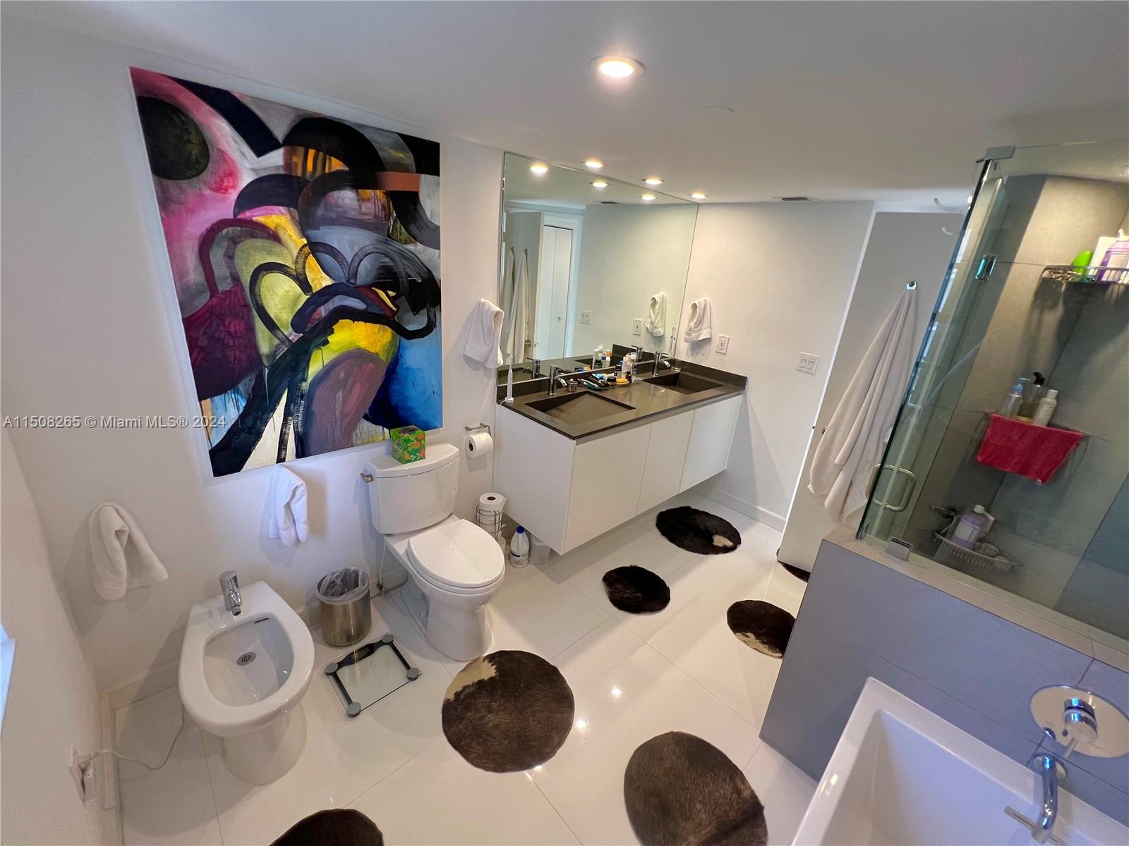 151 Southeast 15th Road, Unit 2401 Miami, FL 33129 - Photo 40 of 45 a kitchen with a sink a stove and a chair