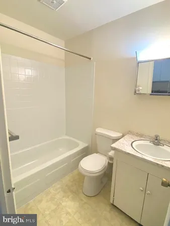 a bathroom with a sink a toilet and a bathtub