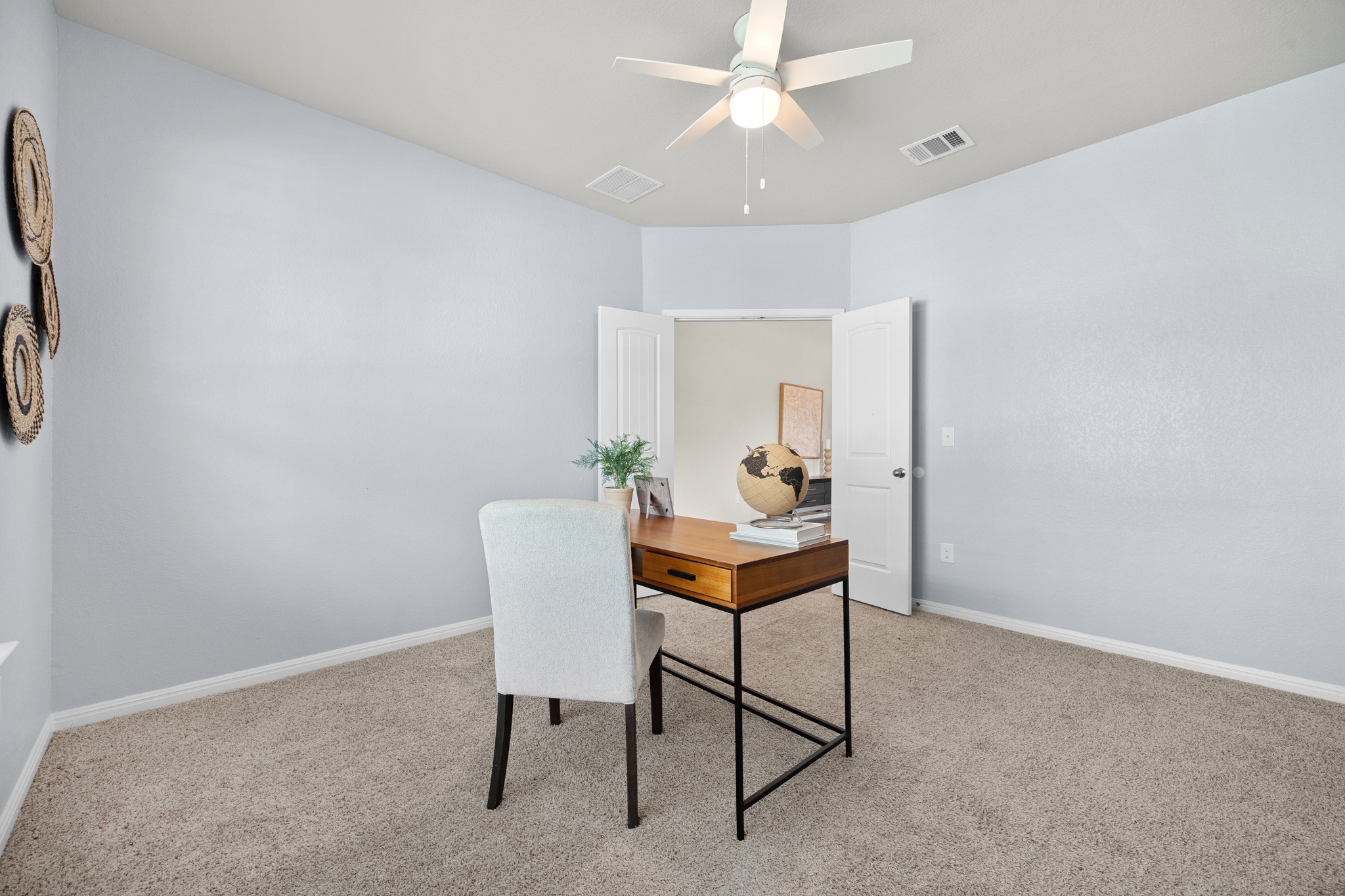 2413 Starhill Ranch Street Georgetown, TX 78628 - Photo 11 of 40 a view of a workspace with furniture and a chandelier fan