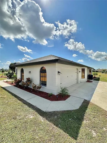 a house view with a backyard space