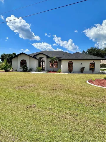 a view of swimming pool with an outdoor seating