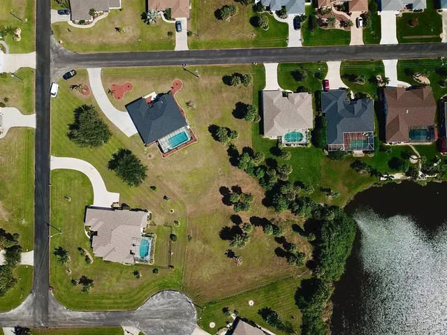 an aerial view of a house with outdoor space