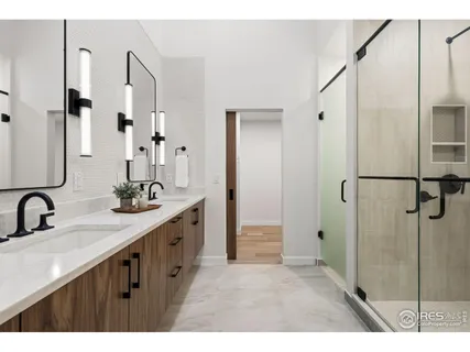 a bathroom with a double vanity sink mirror and double