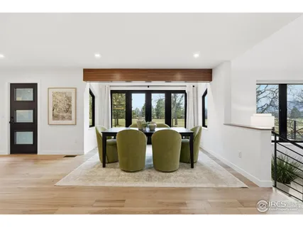 a living room with furniture window and a flat screen tv