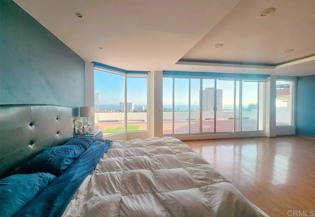 167 Marina San Diego Real De San Marino Ensenada Mex San Diego, CA 92101 - Photo 11 of 21 a spacious bedroom with a large bed and a large window