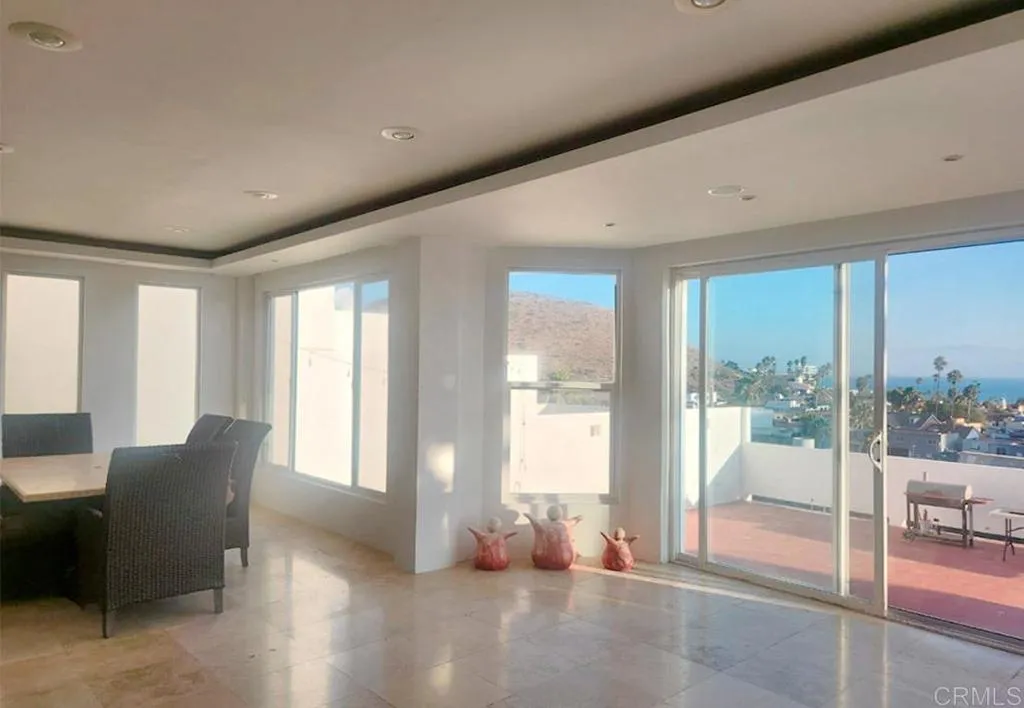 167 Marina San Diego Real De San Marino Ensenada Mex San Diego, CA 92101 - Photo 14 of 21 a living room with furniture and a floor to ceiling window