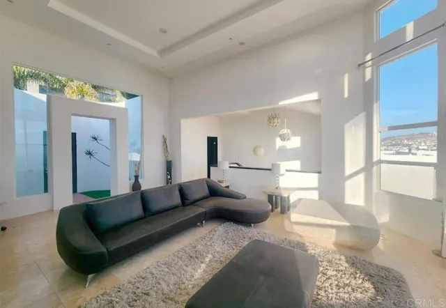 a view of a dining room with furniture wooden floor and chandelier