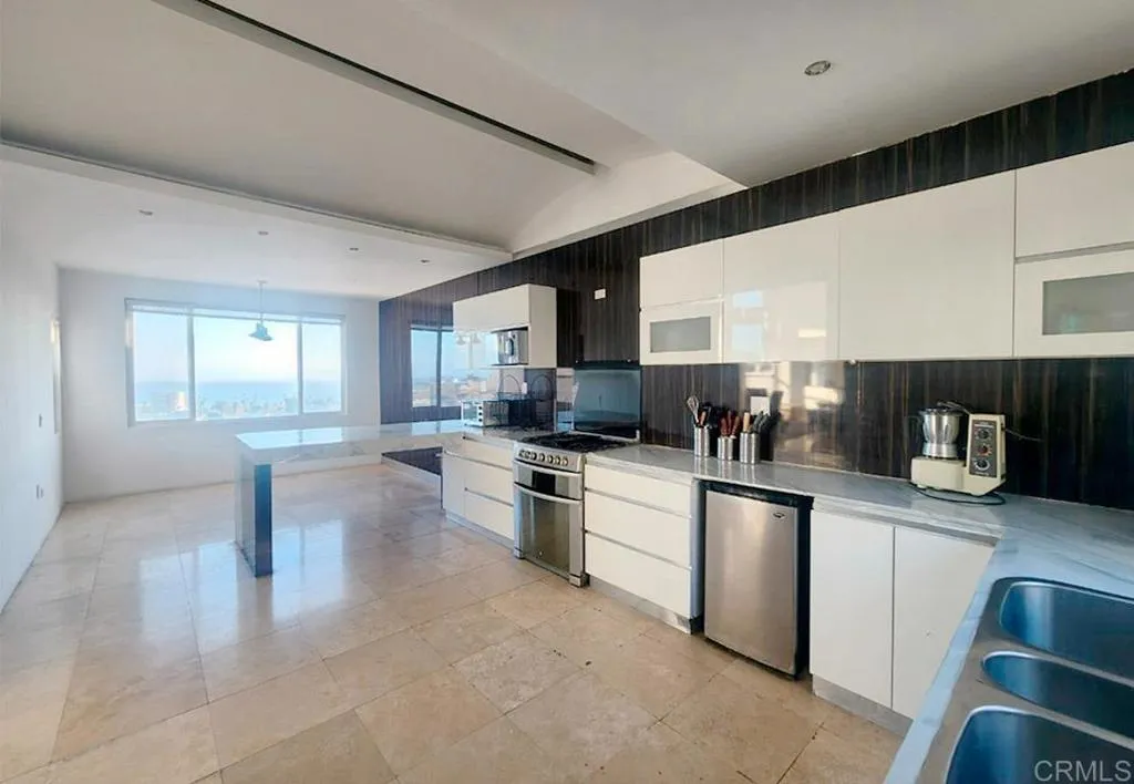 167 Marina San Diego Real De San Marino Ensenada Mex San Diego, CA 92101 - Photo 10 of 21 a kitchen with stainless steel appliances granite countertop a sink and cabinets