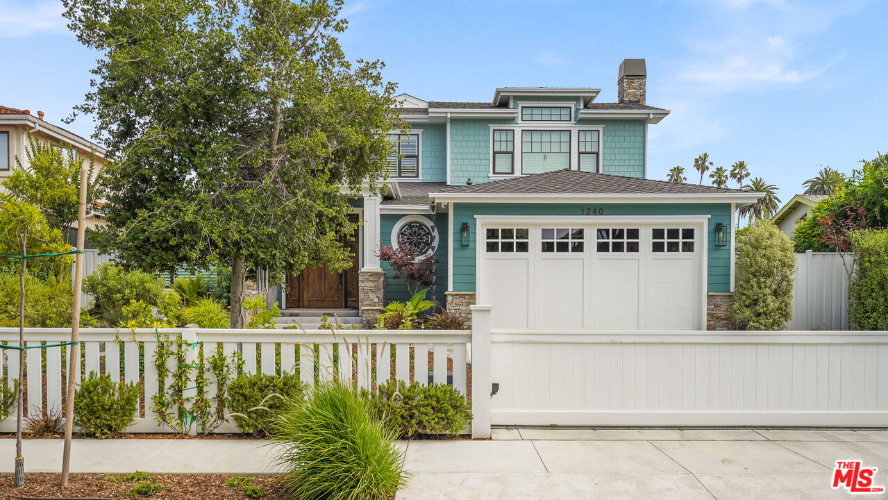 a front view of a house with a small yard