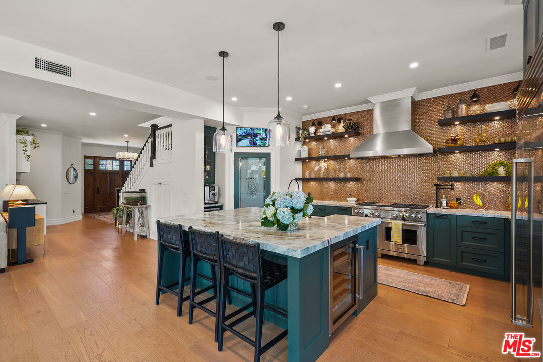 1240 Appleton Way Venice, CA 90291 - Photo 16 of 71 a kitchen with stainless steel appliances granite countertop a stove oven and a refrigerator