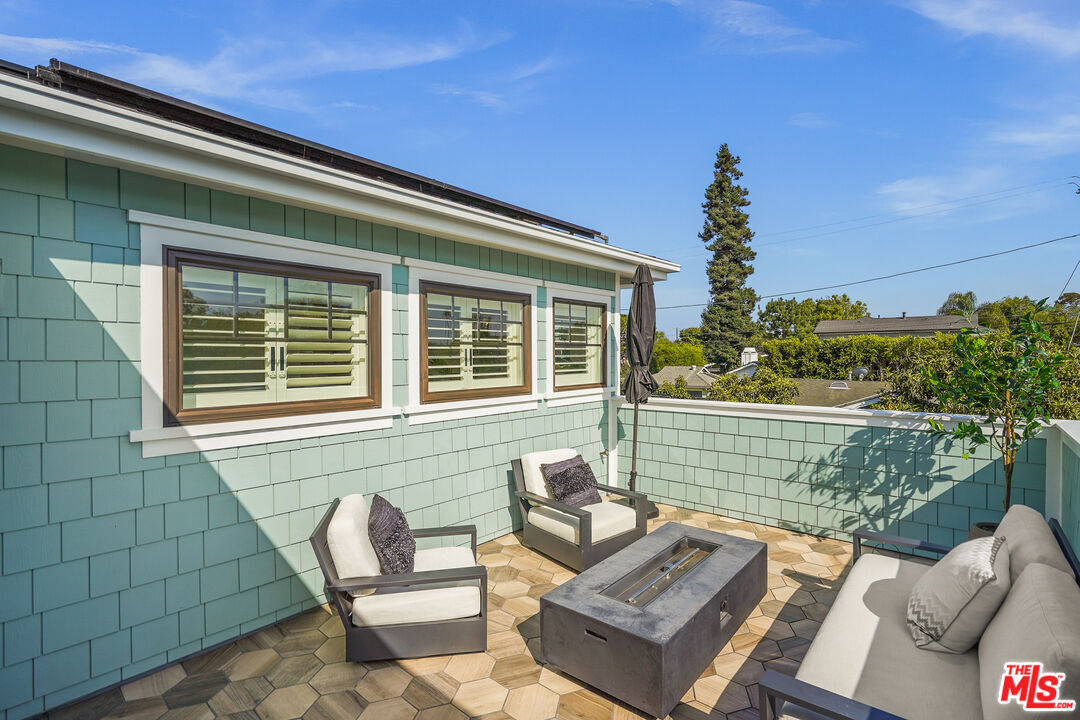 1240 Appleton Way Venice, CA 90291 - Photo 29 of 71 a view of a patio with couches chairs and potted plants