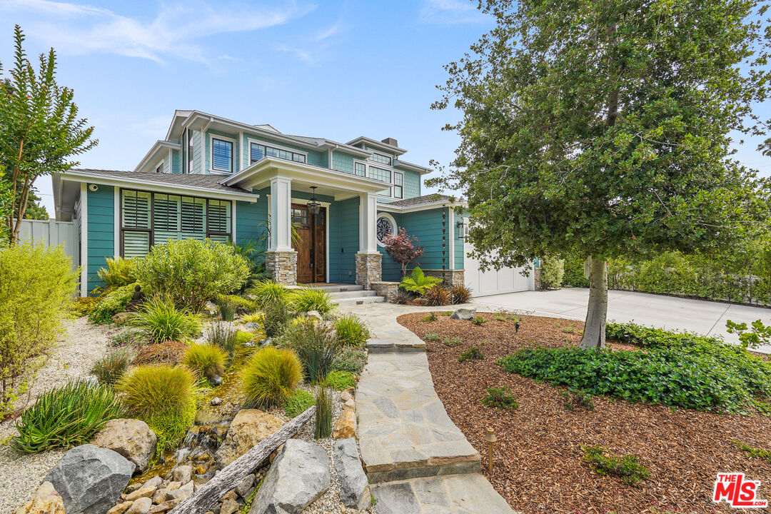 1240 Appleton Way Venice, CA 90291 - Photo 4 of 71 a front view of a house with a yard and potted plants