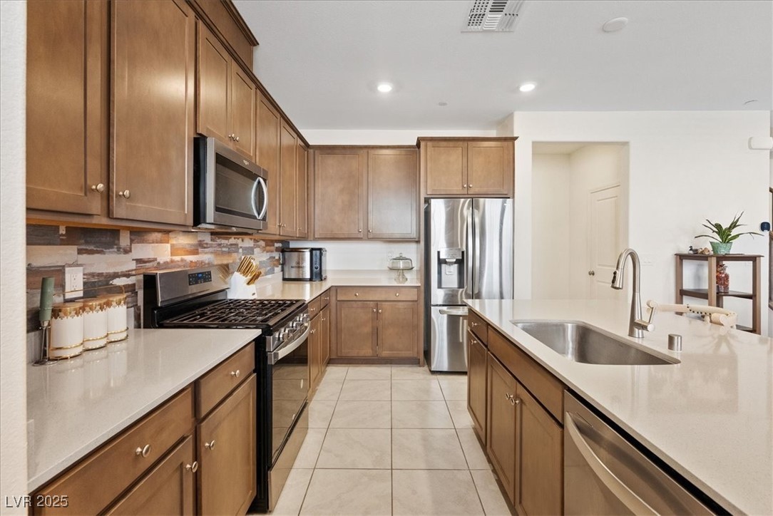 3732 Via Gennaro Henderson, NV 89044 - Photo 14 of 45 Custom cabinets with brushed stainless appliances.
