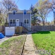76 Rosewood Road Rocky Point, NY 11778 - Photo 1 of 1 front view of a house with a yard