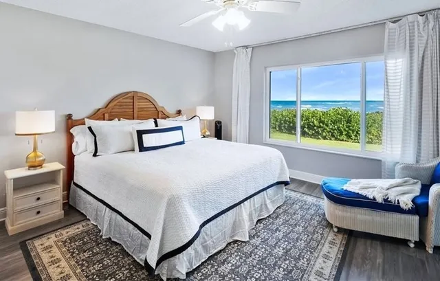 a kitchen with a white cabinets and window