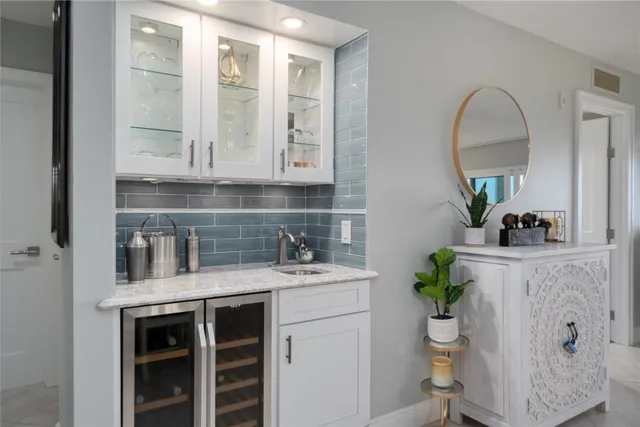 an aerial view of a house with swimming pool and garden