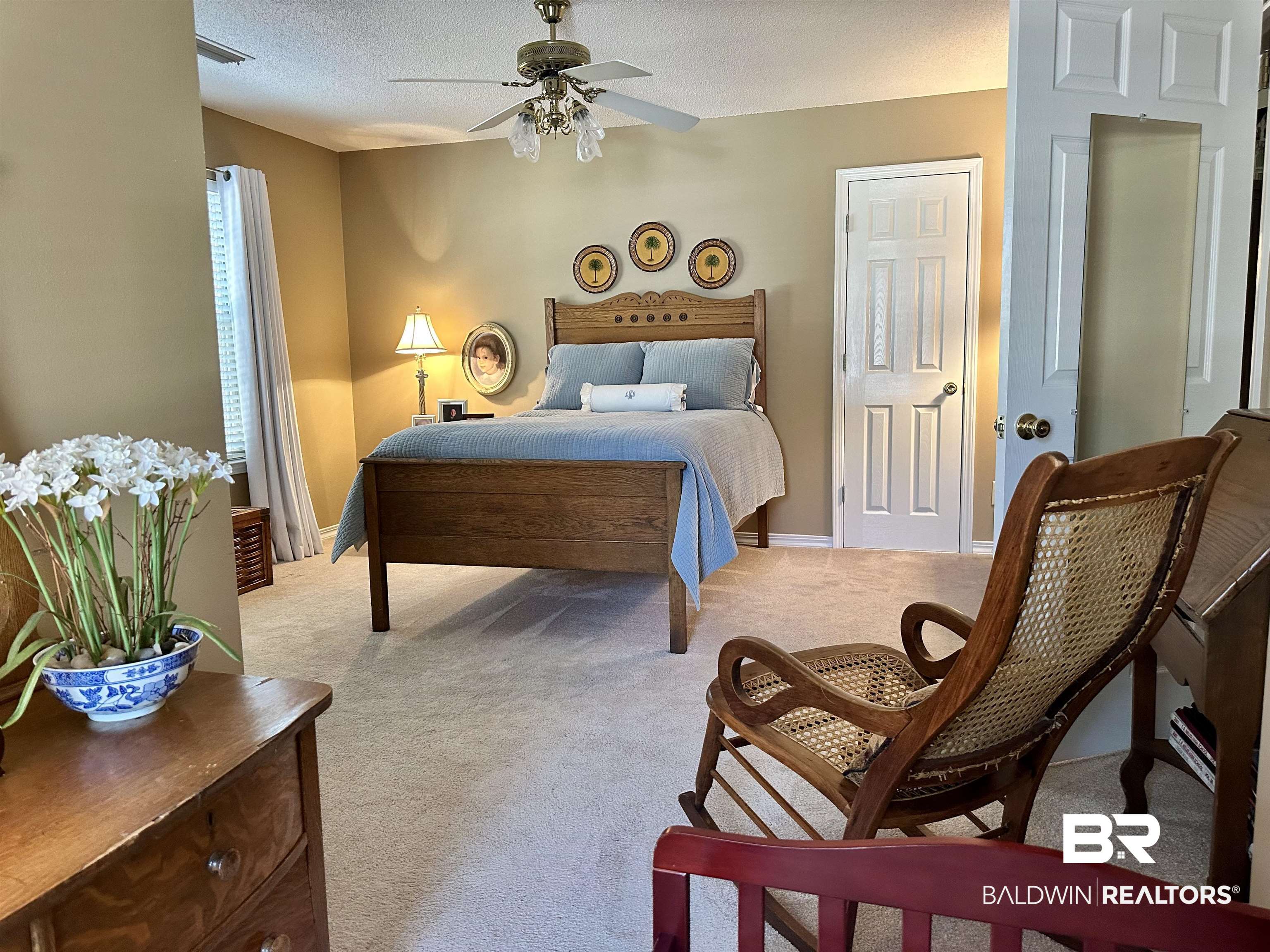 148 Brooks Boulevard Brewton, AL 36426 - Photo 24 of 45 Carpeted bedroom featuring baseboards, a textured ceiling, and ceiling fan