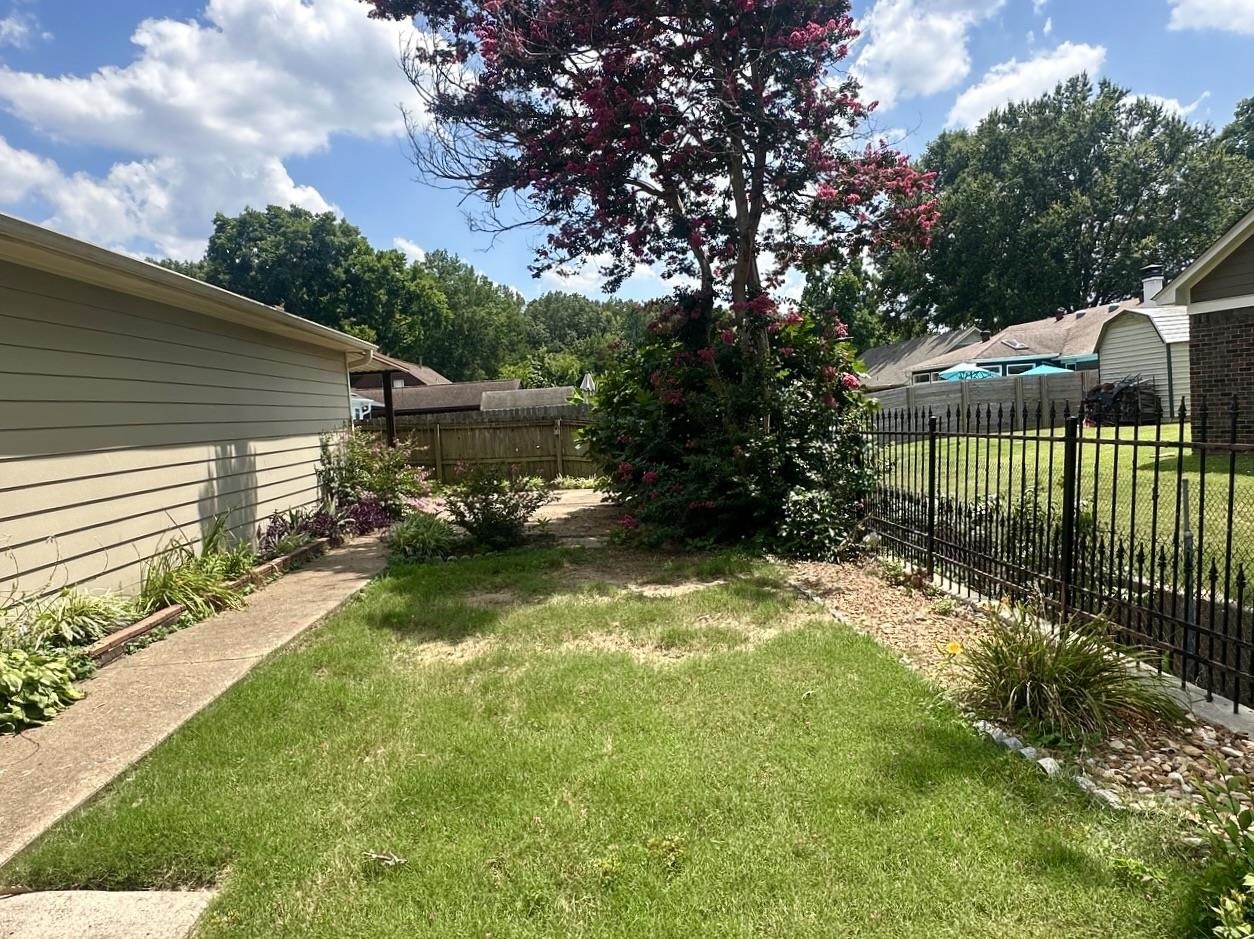 3489 Evening Light Drive Bartlett, TN 38135 - Photo 26 of 30 a view of a backyard with a garden