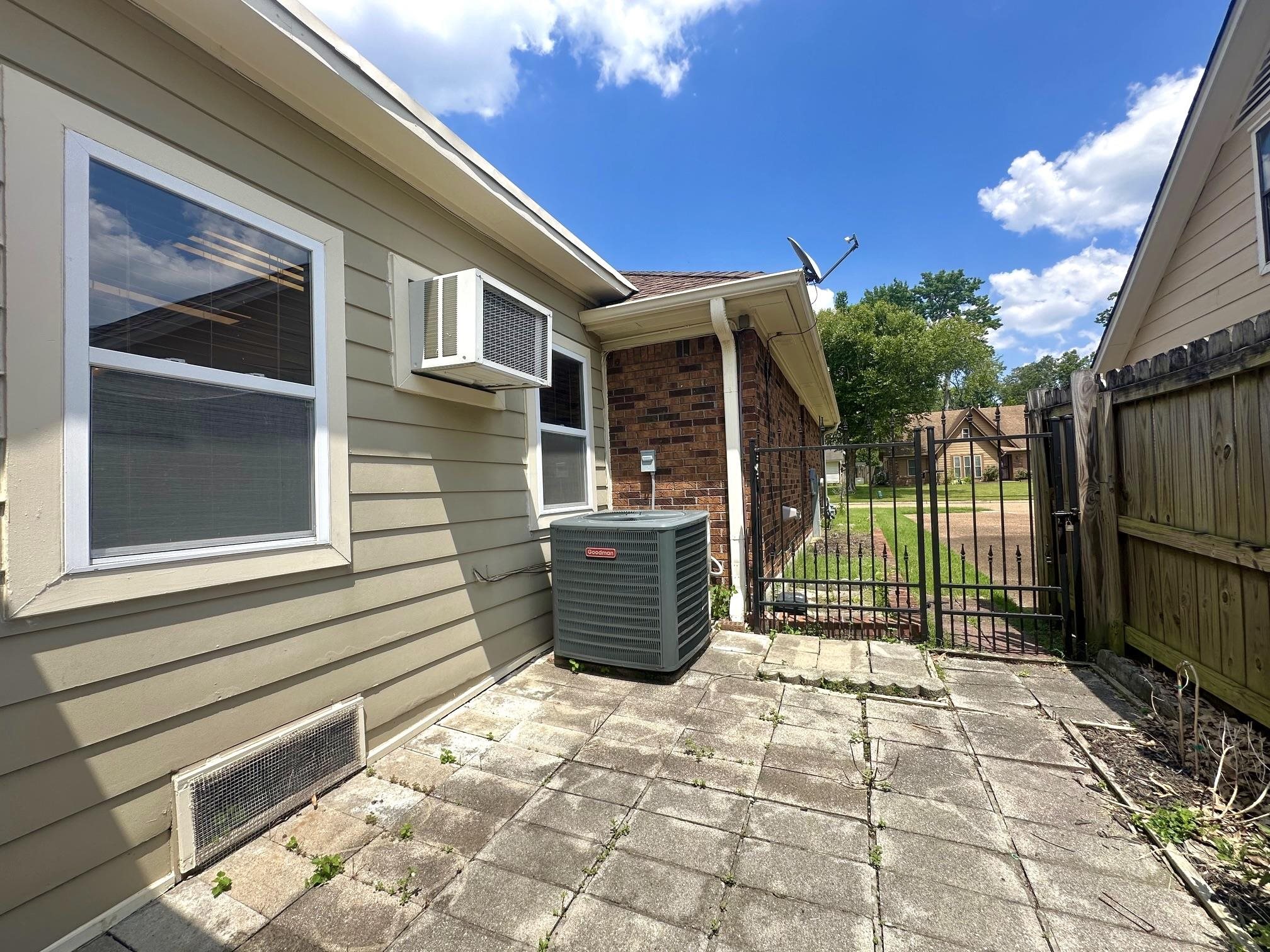 3489 Evening Light Drive Bartlett, TN 38135 - Photo 27 of 30 a backyard of a house with barbeque oven and outdoor seating