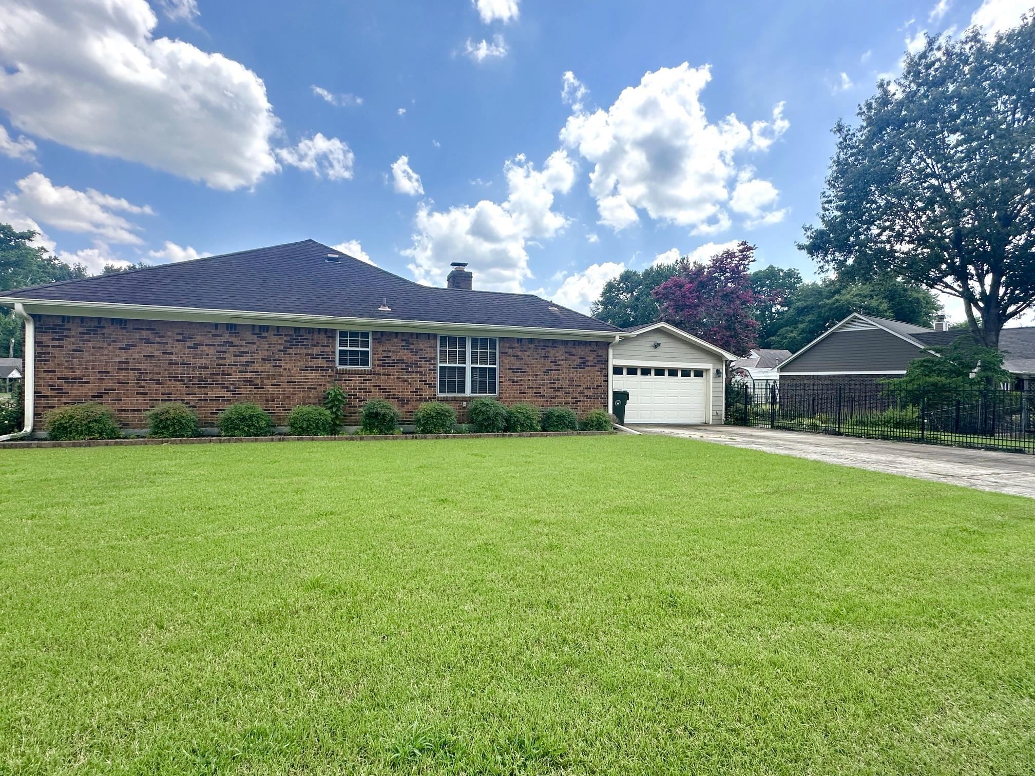 3489 Evening Light Drive Bartlett, TN 38135 - Photo 4 of 30 a front view of a house with garden