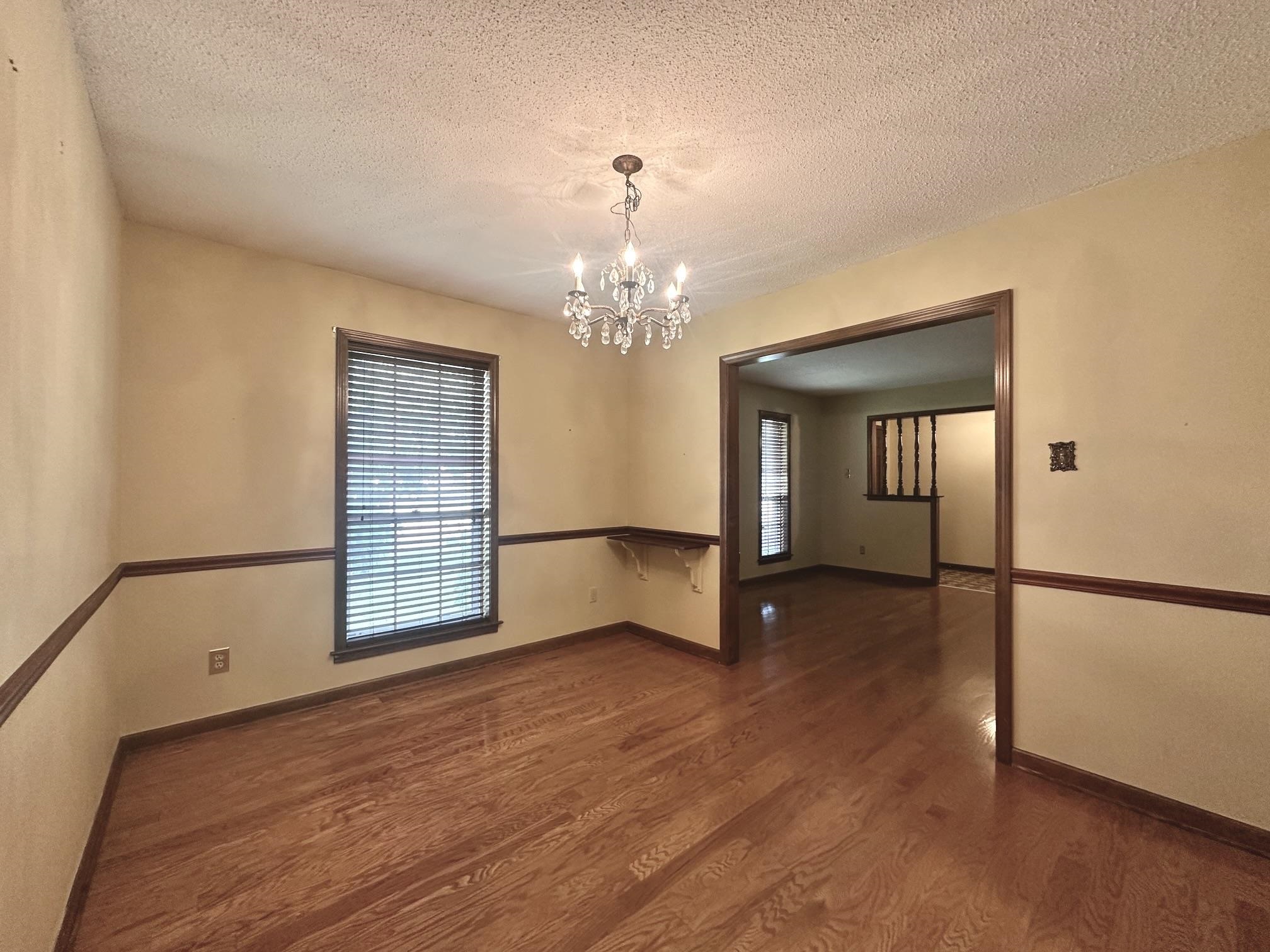 3489 Evening Light Drive Bartlett, TN 38135 - Photo 9 of 30 a view of an empty room with window and wooden floor