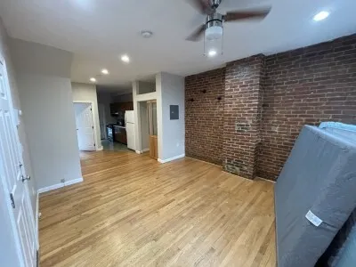 a view of wooden floor and windows in a room