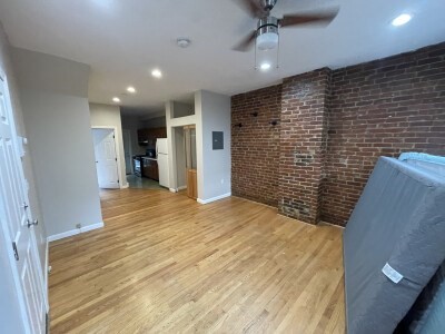 24 Pompeii Street, Unit 1 Boston, MA 02119 - Photo 4 of 10 a view of empty room with wooden floor