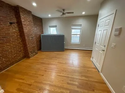 a view of gallery with wooden floor