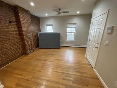 24 Pompeii Street, Unit 1 Boston, MA 02119 - Photo 5 of 10 a view of wooden floor and windows in a room