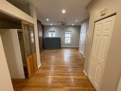 24 Pompeii Street, Unit 1 Boston, MA 02119 - Photo 6 of 10 a view of gallery with wooden floor