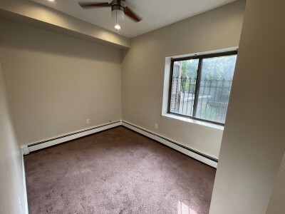 24 Pompeii Street, Unit 1 Boston, MA 02119 - Photo 8 of 10 an empty room with a window