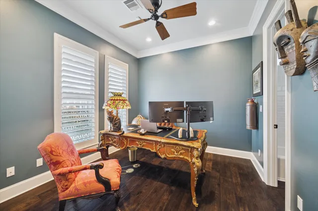 a workspace with wooden floor and a window