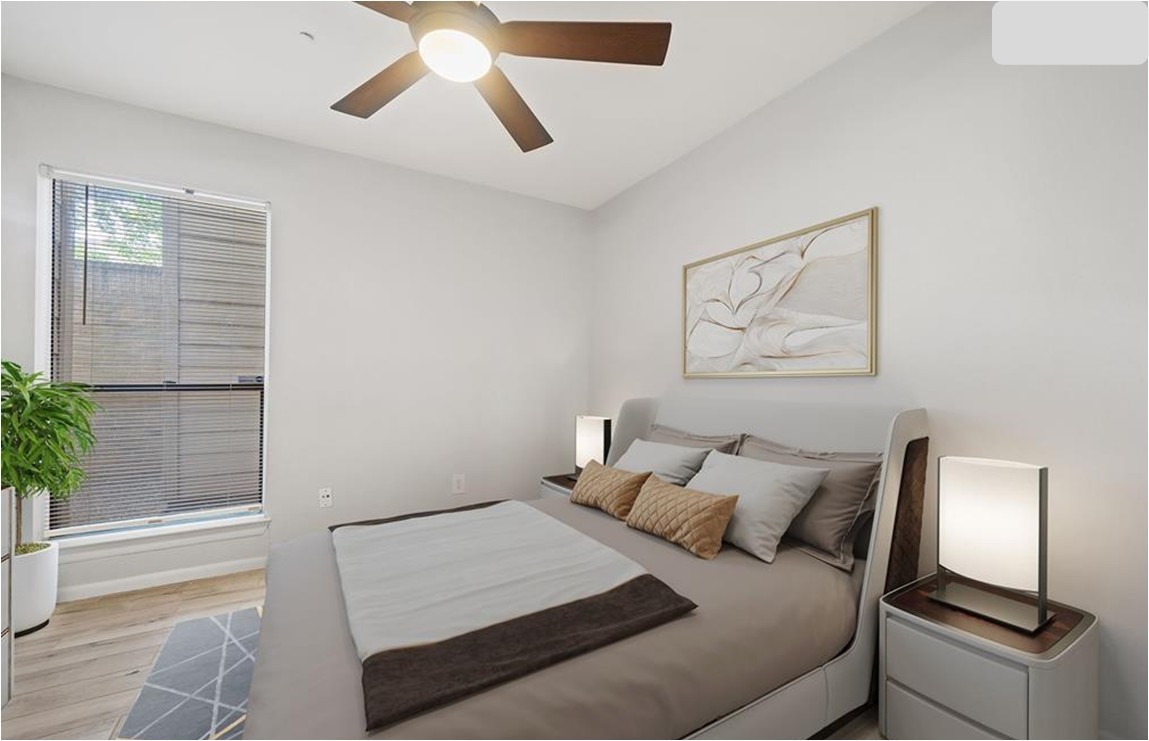 2277 South Kirkwood Road, Unit 1101 Houston, TX 77077 - Photo 11 of 18 a bedroom with a bed and a painting on the wall