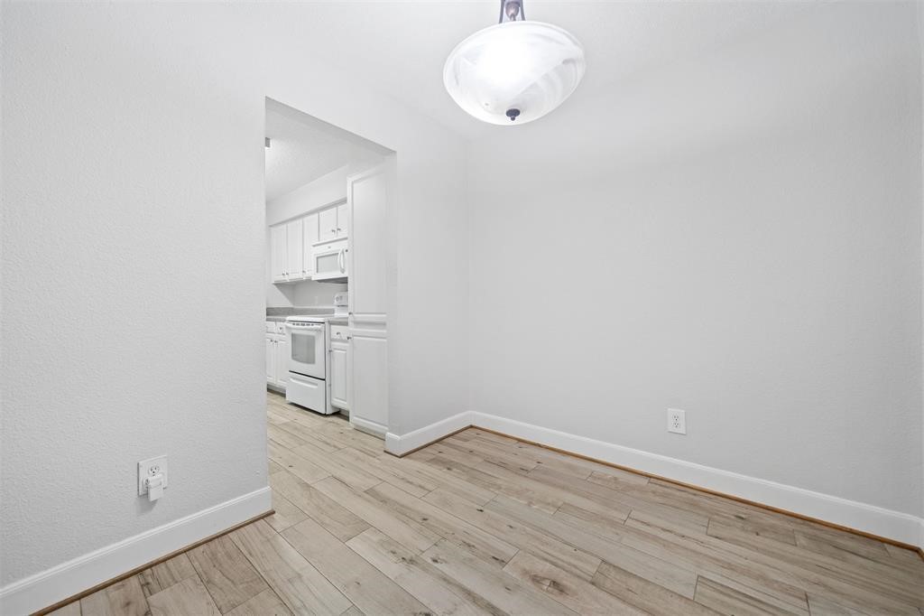 2277 South Kirkwood Road, Unit 1101 Houston, TX 77077 - Photo 5 of 18 a view of a room with wooden floor