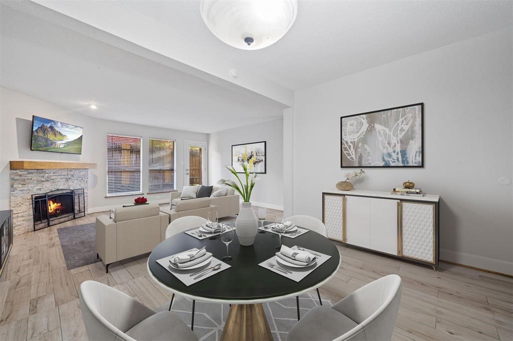 2277 South Kirkwood Road, Unit 1101 Houston, TX 77077 - Photo 8 of 18 a living room with furniture and a fireplace