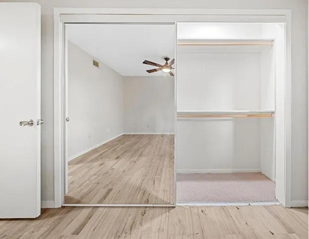 a bathroom with a double vanity sink mirror and toilet