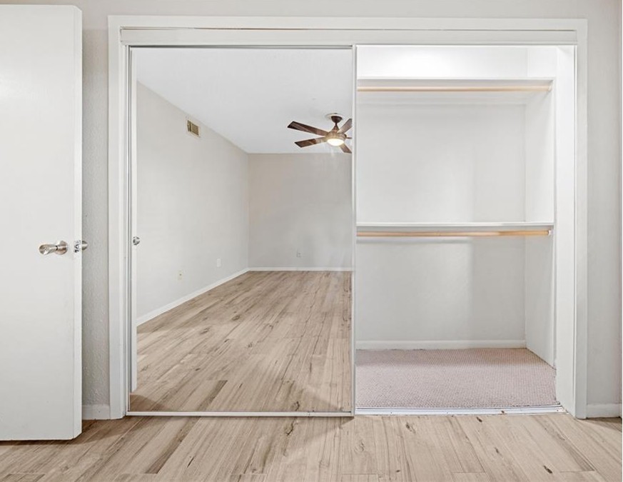 2277 South Kirkwood Road, Unit 1101 Houston, TX 77077 - Photo 9 of 18 a view of walk in closet with empty racks