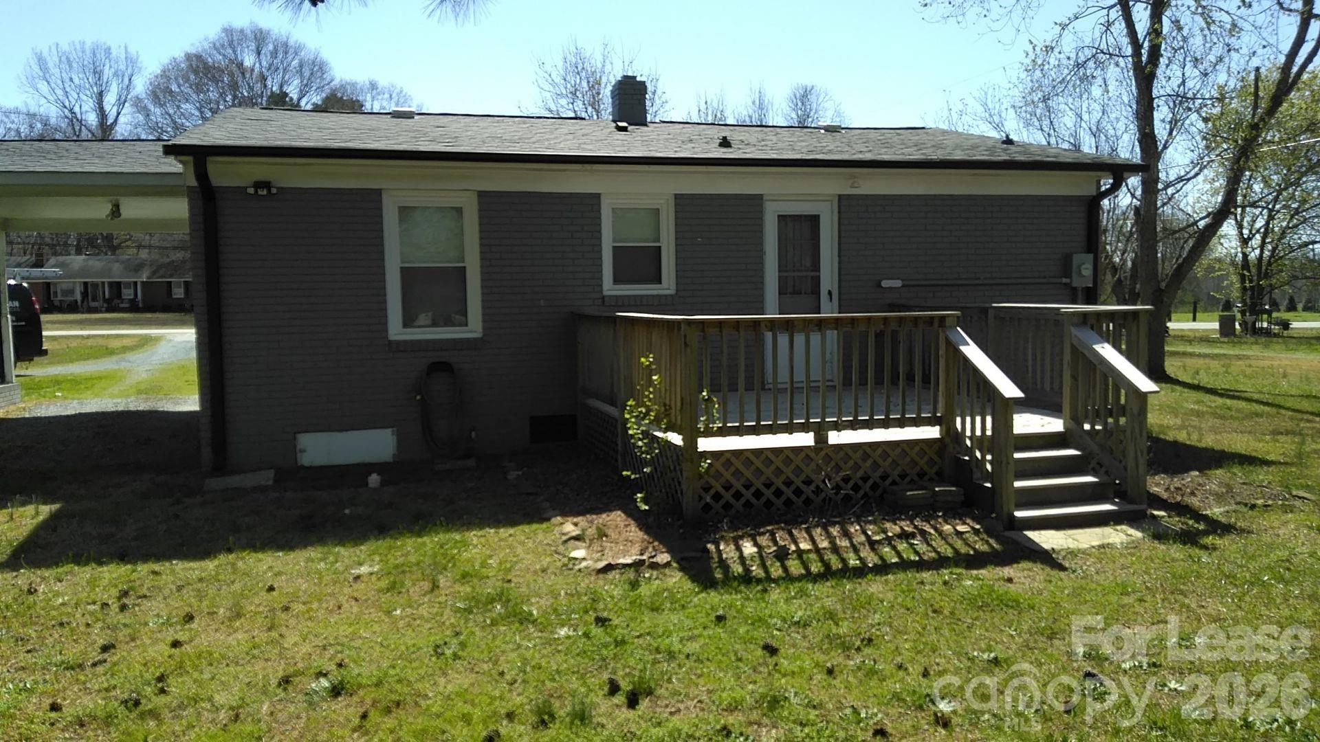 408 West Sandy Ridge Road Monroe, NC 28112 - Photo 2 of 11 a view of a house with a yard