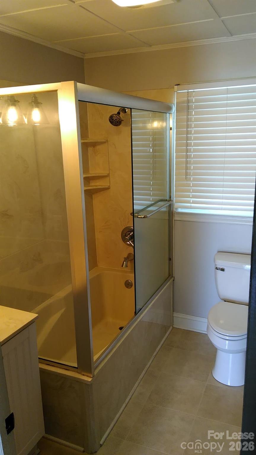408 West Sandy Ridge Road Monroe, NC 28112 - Photo 4 of 11 a bathroom with a shower and toilet