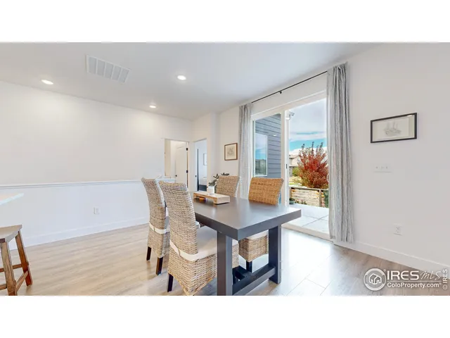 a kitchen with a table and chairs in it