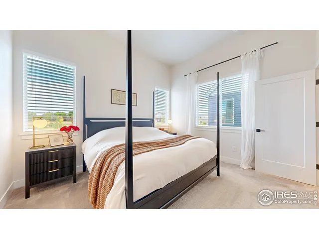 a bedroom with a bed and a closet