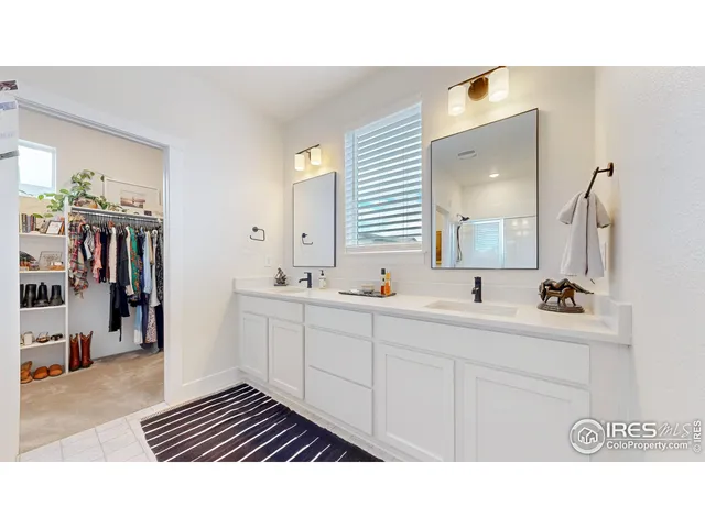 a bathroom with a sink a mirror and a shower