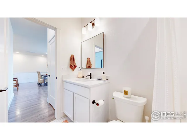 a bathroom with a sink a mirror and a toilet